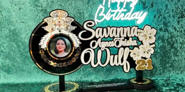 Custom wooden 21st birthday key on display stand in Australia